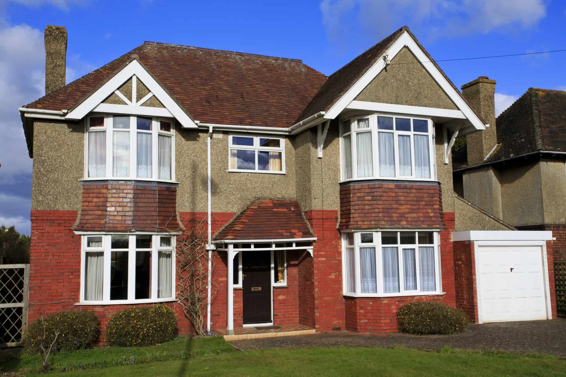 Large pebble dashed detached house with garage in Swindon, UK